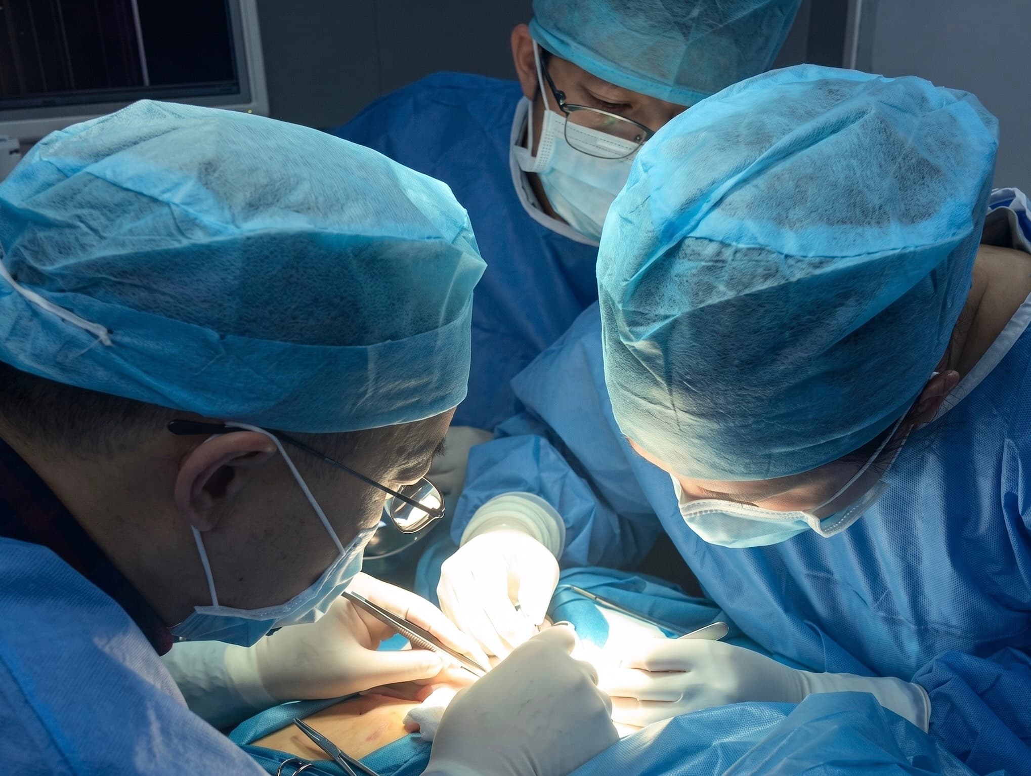 A surgical team performing an operation in the operating room